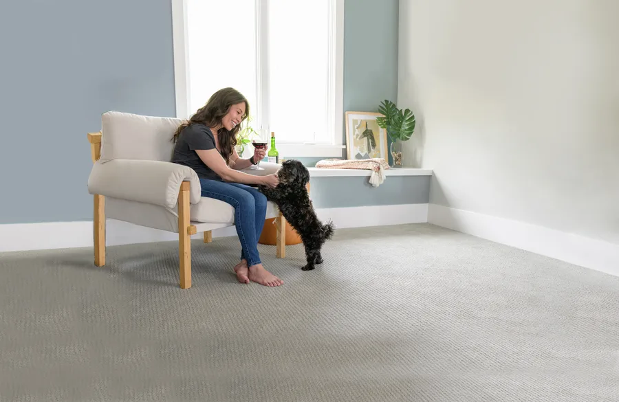 A woman relaxing with her dog on a freshly cleaned sofa